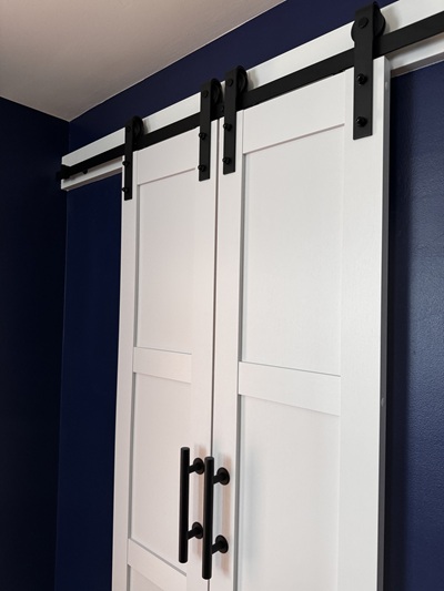 Barn door installation details with blue paint